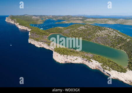 Cliffs in National park Telascica with lake Mir, Adriatic sea, Croatia Stock Photo