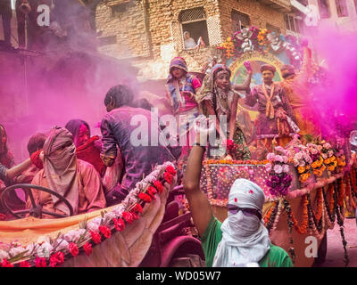 Locals in parade, Celebrating Holi Holiday, Mathura, Uttar Pradesh, India, Asia Stock Photo