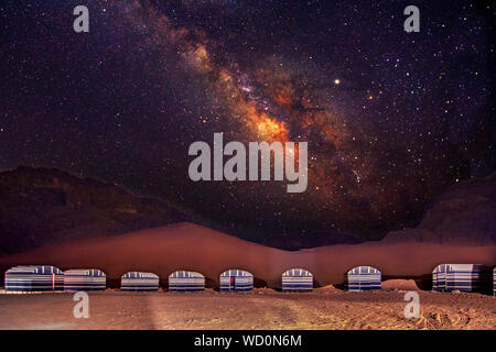 A camp in Wadi Rum desert at night with milky way, Jordan. Stock Photo