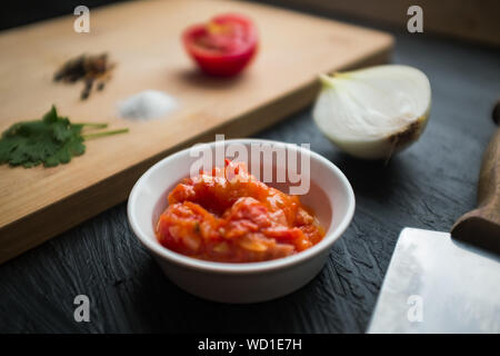 Ingredients and Preparation of Typical Sauce Colombian: Hogao Stock Photo