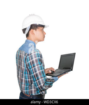 Engineer while holding using Laptop and head wear white safety helmet plastic . Concept Work construction on white background Stock Photo