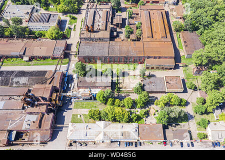 city industrial district. old factory buildings with rusty roofs, aerial view Stock Photo