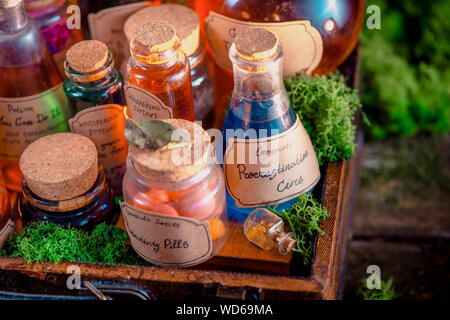 Potions, mixtures, and remedies for inspiration, motivation and productive work close-up. Handwritten potion label. Self-care concept. Stock Photo