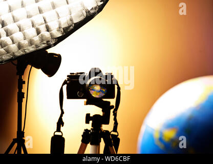 World reflection through a camera lens in a photography studio. Stock Photo