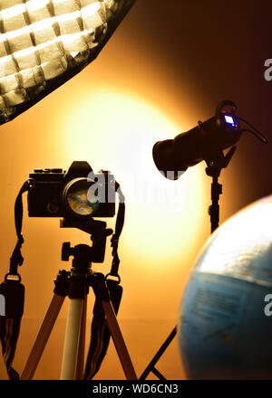 World reflection through a camera lens in a photography studio. Stock Photo