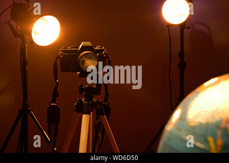 World reflection through a camera lens in a photography studio. Stock Photo
