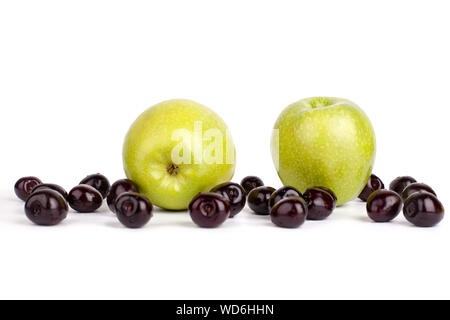 Two green apples and cherry berries on white background isolated close up macro Stock Photo