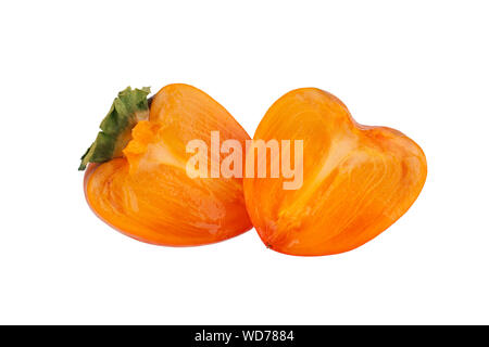 Persimmon orange fruit with green leaves cut in two halves on white background isolated close up Stock Photo