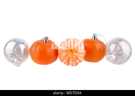 New Year border, Christmas pattern, Christmas tree decorations, silver glass balls, tangerines, mandarines on white background isolated close up Stock Photo