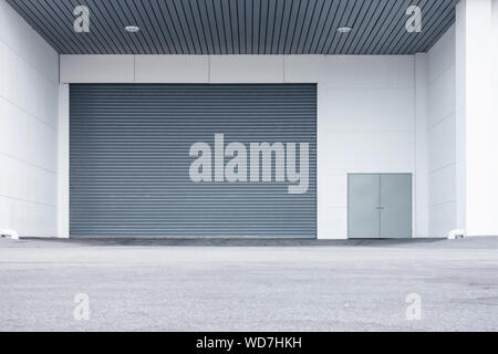 Automatic Factory Shutter Roller Door Indoor, Steel Rolling Gate Door for Security System of Warehouse Storage. Architecture Metal Access Doorway With Stock Photo