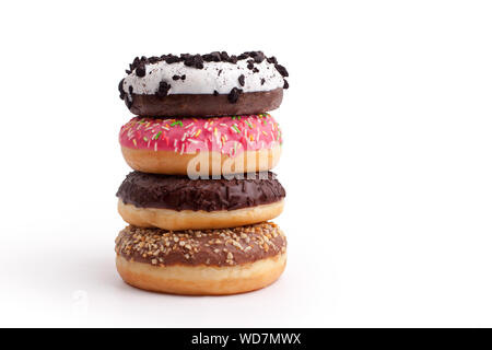 A stack of different donuts on a white background close up isolated Stock Photo