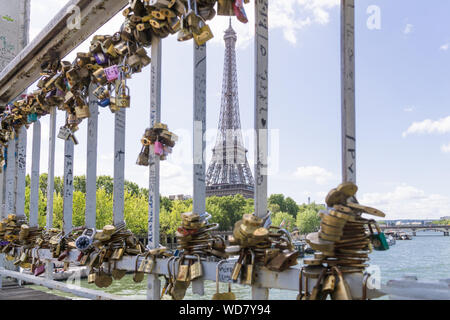 Paris love padlocks - Love padlocks locked on the Debilly footbridge with a view of the Eiffel Tower in Paris, France, Europe. Stock Photo