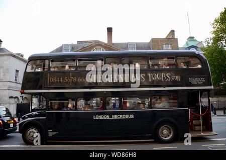 a routemaster bus painted black full of tourists on the ghost bus tours london tour uk Stock Photo