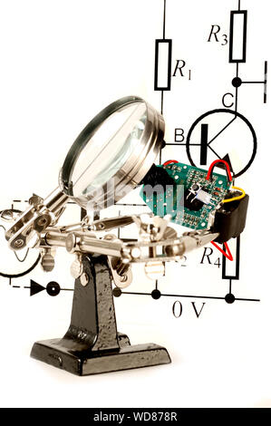 Electrical Circuit Board under a magnify glass Stock Photo - Alamy
