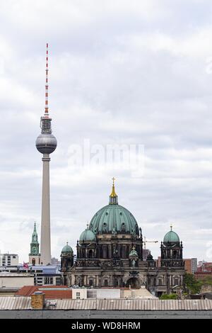 Vertical shot of the Berlin Catehdral and Fernsehturm Television Tower in Berlin, Germany Stock Photo