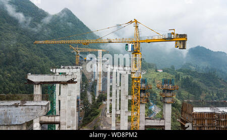 Zunyi. 28th Aug, 2019. Aerial photo taken on Aug. 28, 2019 shows the construction site of Weijiazhai grand bridge of the Lanzhou-Haikou expressway in southwest China's Guizhou Province. The Guizhou section of the Lanzhou-Haikou expressway is expected to open to traffic in 2022. Credit: Tao Liang/Xinhua/Alamy Live News Stock Photo