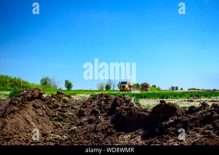 Dump trucks are in transport on building site, passing over. Stock Photo