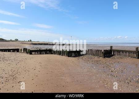 Heacham north on a sunny day with blue clear skies. Shoreline and beach in view. Stock Photo