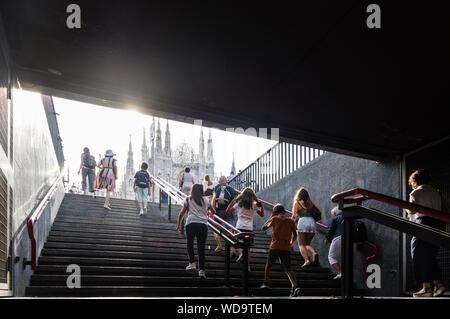 Milano, Italy (8th August 2019) - The exit of the subway station of Piazza Duomo with the famous cathedral immediately showing up Stock Photo