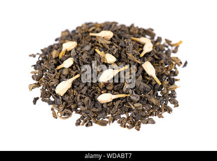 Green tea with jasmine, isolated on white background. Aromatic green dry tea, close up. Stock Photo