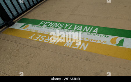 Sign on the floor indicating the border between New Jersey and Pennsylvania, New Hope Stock Photo