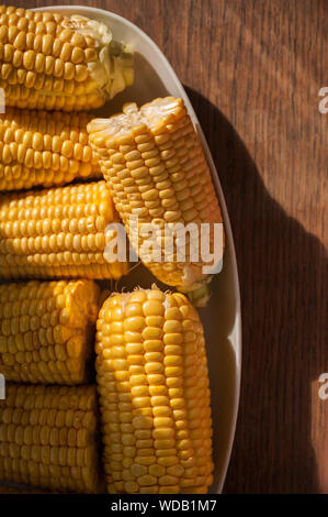 Corn cobs on the plate close up Stock Photo