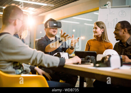 Business People Group testing Vr Headset During Brainstorming, Team In 3d Glasses On Meeting Virtual Reality Technology Concept. Stock Photo