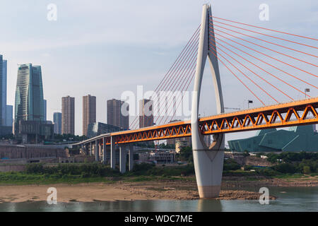 Chongqing, CHINA - May 10, 2019 : Cityscape and skyline of downtown near Chongqing Dongshuimen Bridge and Yangtze river. Chongqing, China. Stock Photo