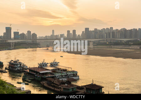 Chongqing, CHINA - May 10, 2019 : Cityscape and skyline of downtown near Chongqing Dongshuimen Bridge and Yangtze river. Chongqing, China. Stock Photo