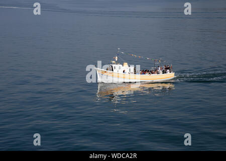 Sea Jay pleasure boat taking holidaymakers on a cruise around the North shore of Llandudno Bay, North Wales in summer Stock Photo