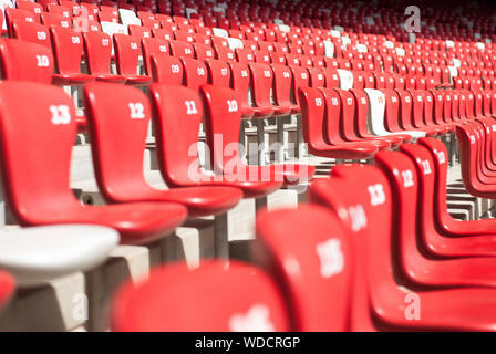 Rows of red chairs in the National stadium (bird's nest) of Beijing. Stock Photo