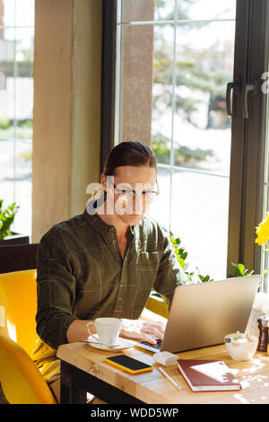 Top view of a positive young man working Stock Photo