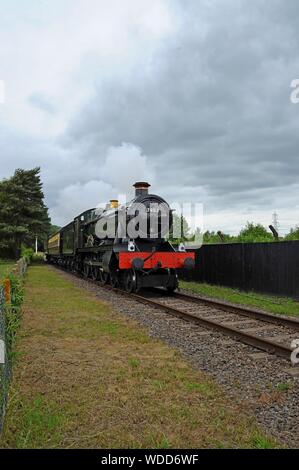 Ex Great Western Railway Locomotive 7903 'Foremarke Hall' pulls a passenger train at  Didcot Railway Centre, Oxfordshire Stock Photo