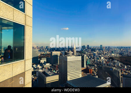 View of the Japanese capital city and close skyscrapers as seen from the Metropolitan Government Building in downtown Tokyo. Stock Photo