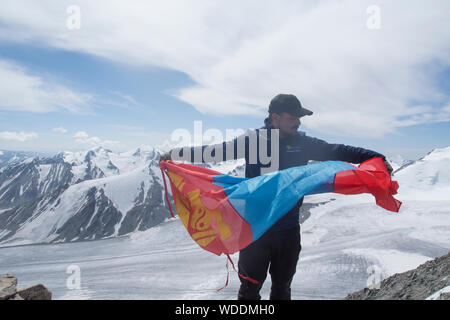 Alpinists in the summit of Malchin Peak in Altain Mountains, Mongolia Stock Photo