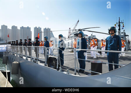 (190829) -- QINGDAO, Aug. 29, 2019 (Xinhua) -- Soldiers stand on destroyer Xining at a port in Qingdao, east China's Shandong Province, Aug. 29, 2019. The 33rd fleet from the Chinese People's Liberation Army (PLA) Navy on Thursday left the port city of Qingdao in east China's Shandong Province for the Gulf of Aden to escort civilian ships. (Xinhua/Li Ziheng) Stock Photo