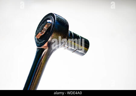 a chrome socket wrench on white background Stock Photo
