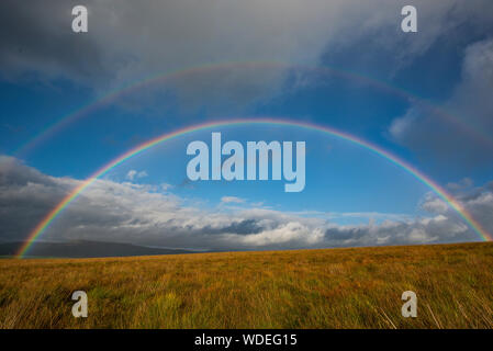Double rainbow over Bentham moor Yorkshire. Stock Photo