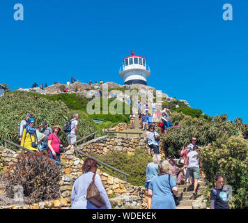 Tourists climbing the steps up to the old Cape Point Lighthouse, Cape of Good Hope, Western Cape, South Africa Stock Photo
