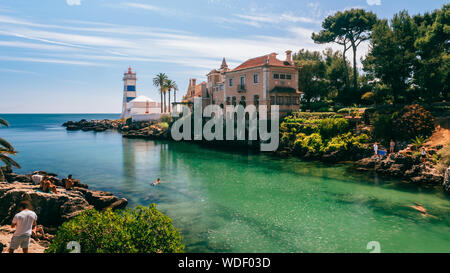 Cascais, Lisbon, Portugal - August 29, 2019: View of Santa Marta lighthouse and Municipal museum of Cascais, in Portugal with tourists Stock Photo