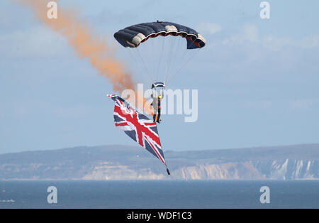 A member of the Tigers Freefall Parachute Display Team performs for the crowds on day one of the Bournemouth Air Festival 2019. Stock Photo