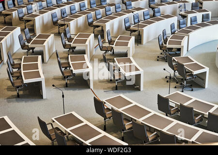 Hannover, Germany, August 24., 2109: Empty row of chairs with work tables in the plenum of the Lower Saxony Parliament at the Open Day Stock Photo