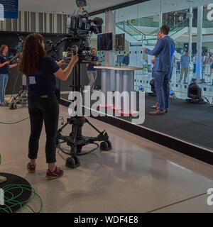 Hannover, Germany, August 24., 2109: Camera team with a camera woman of the North German Broadcasting NDR films with a professional camera at opening Stock Photo