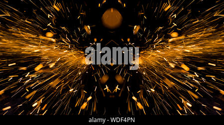 Bright yellow sparks on a black background Stock Photo