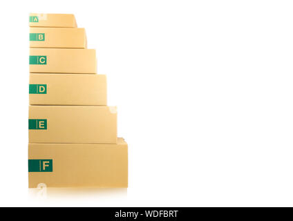 Cardboard parcel boxes stacked on each other at white background Stock Photo