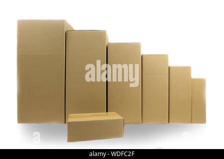 Cardboard parcel boxes stacked on each other at white background Stock Photo
