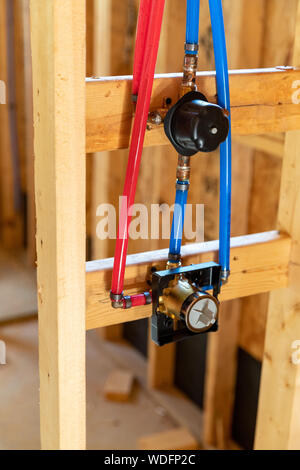 Shower faucet and water pipes in new home construction Stock Photo