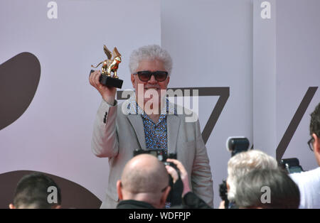 VENICE, Italy. 29th Aug, 2019. Pedro Almodovar shows the Golden Lion at Palazzo del Cinema after receiving it for lifetime achievements during the 76th Venice Film Festival on August 29, 2019 in Venice, Italy. Credit: Andrea Merola/Awakening/Alamy Live News