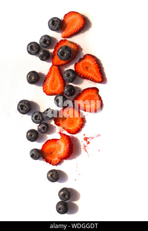 Blackberry and strawberry over white background. Close up, top view, high resolution product Stock Photo