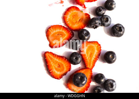 Blackberry and strawberry over white background. Close up, top view, high resolution product Stock Photo